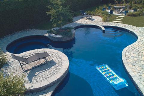 Traditional Pool with large blue outdoor planters