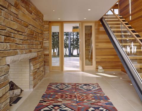 Eclectic Entry with light horizontal wood wall paneling