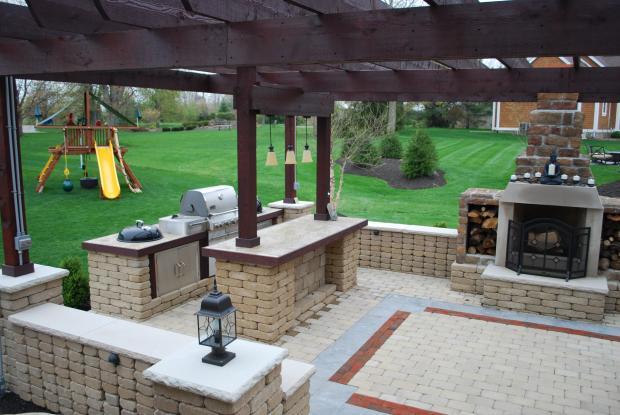 Traditional Outdoor Kitchen with stained concrete counter tops