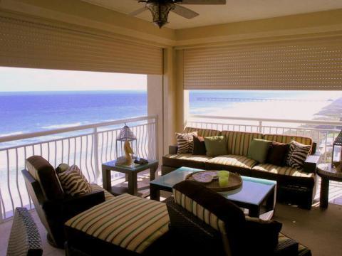 Traditional Sunroom with brown green and zebra print throw pillows