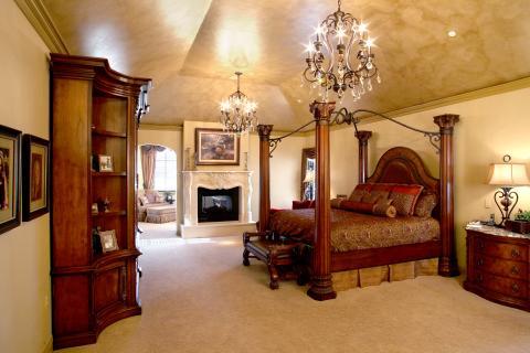 Traditional Bedroom with glass and iron chandelier