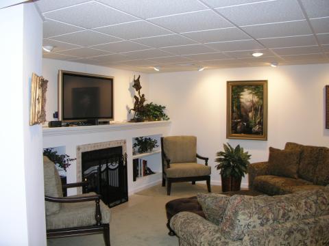 Transitional Family Room with built in white book shelves