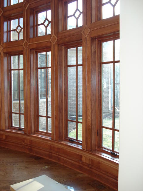 English Dining Room with dark wood window trim