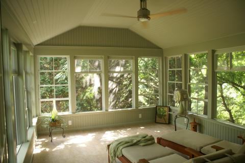 Traditional Sunroom with light wood lounge furniture