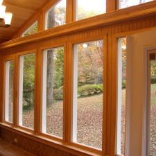 Contemporary Sunroom with light wood paneling