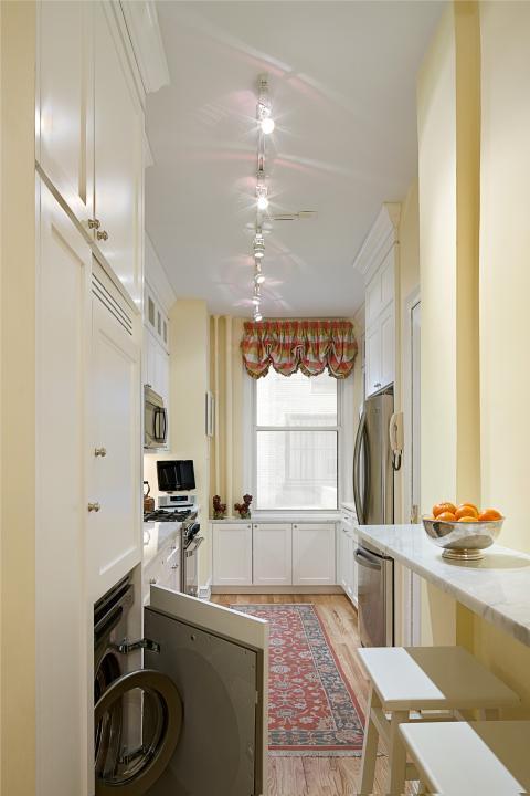 Eclectic Laundry Room with stackable washer and dryer