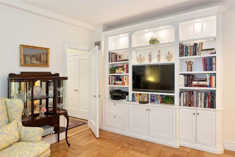 Traditional Family Room with yellow and blue floral upholstered couch