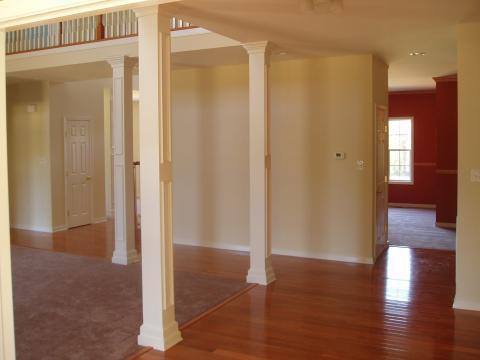 Transitional Entry with dark cherry hardwood flooring