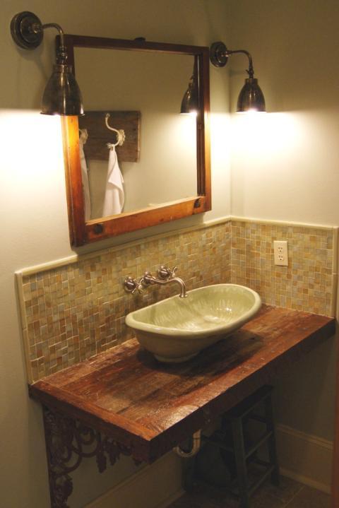Eclectic Bathroom with dark rustic wood framed vanity mirror