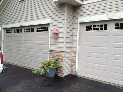 Traditional Garage with gray panel garage door