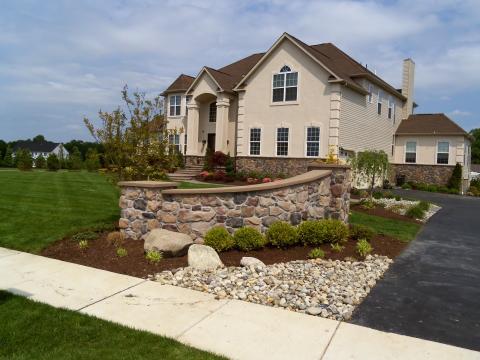 Traditional Home Exterior with outdoor sconce lighting