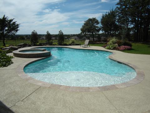 Contemporary Pool with outdoor lounge furniture