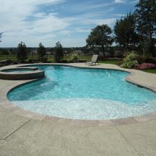 Contemporary Pool with outdoor lounge furniture