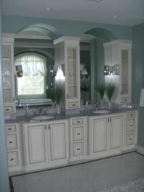 Traditional Bathroom with large wall mounted vanity mirrors