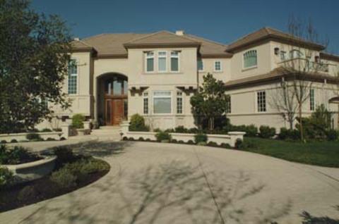 Southwestern Home Exterior with wood exterior door