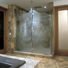 Transitional Master Bathroom with light wood bathroom door with large glass panel