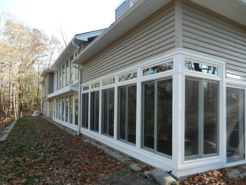 Casual / Comfortable Home Exterior with multiple large windows