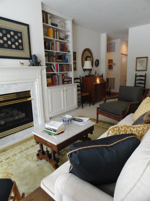 Traditional Living Room with beige sofa with colored pillows
