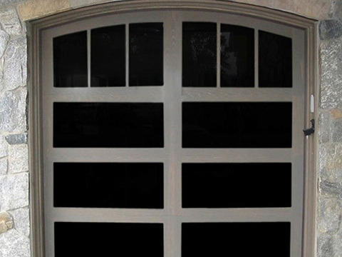 Contemporary Garage with window topped garage door