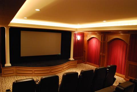 Traditional Home Theater with wall mounted projector screen
