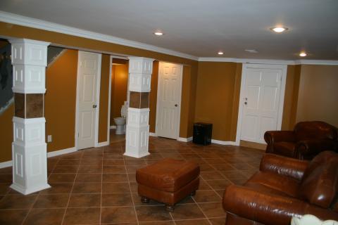 Traditional Basement with brown leather funiture