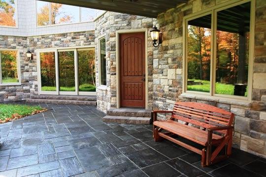 Traditional Patio with dark wood stained front door