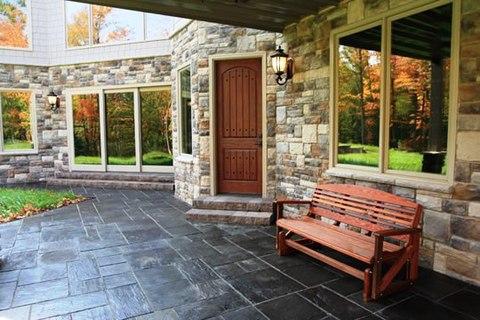Traditional Patio with dark wood stained front door