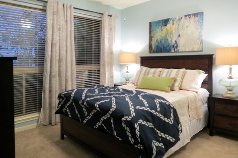 Eclectic Bedroom with blue geometric comforter