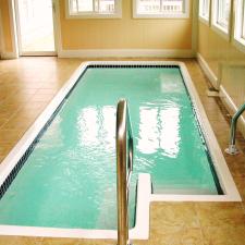 Transitional Sunroom with white trim around swimming pool
