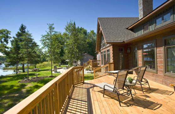 Traditional Deck with natural wood deck railing
