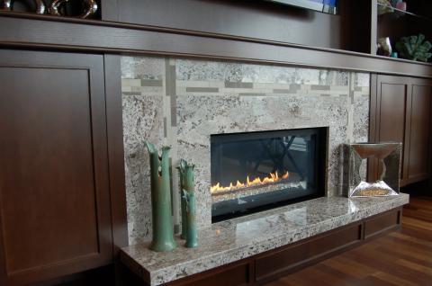 Contemporary Family Room with jade green decor pieces on fireplace hearth