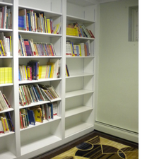 Traditional Library with white built in bookshelves