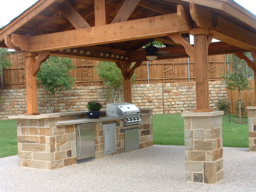 Lodge Outdoor Kitchen with exposed aggregate cement patio