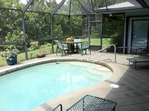 Traditional Sunroom with large sun room with in ground pool