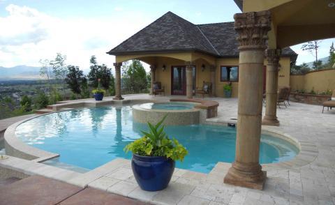Traditional Pool with stone brick patio flooring