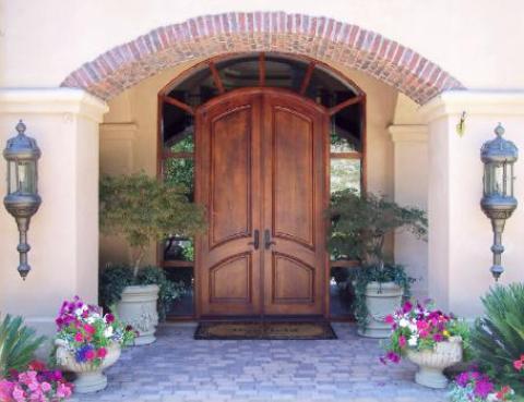 Mediterranean Patio with brick curved accent on over hang
