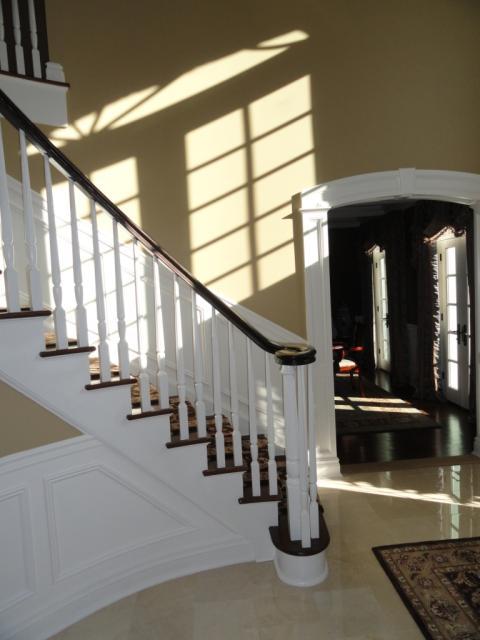 Traditional Entry with white wood wall paneling