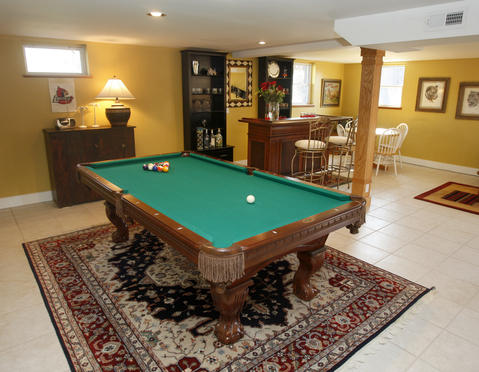 Traditional Basement with green felt pool table
