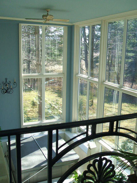 Transitional Sunroom with black wrought iron balcony