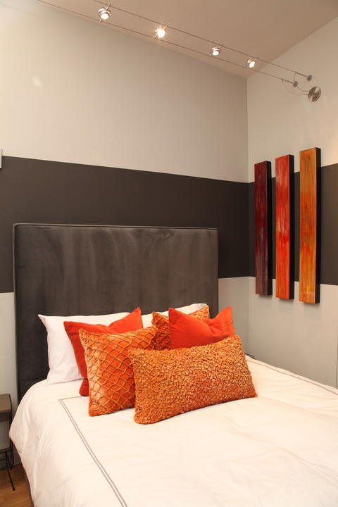 Contemporary Bedroom with natural stained hardwood floor