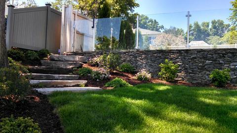 Modern Landscape with stacked stone retaining wall