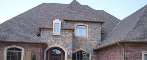Transitional Home Exterior with stone front face exterior