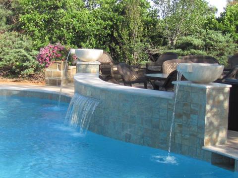 Transitional Pool with large cement water fall feature bowls