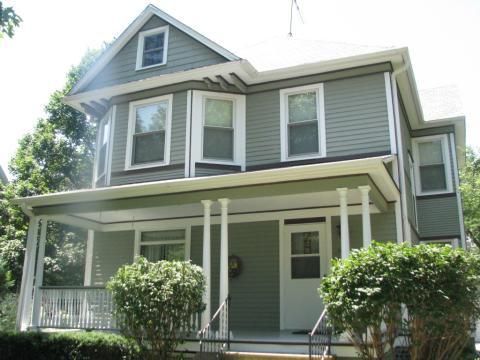 Traditional Porch with white wood columns around porch