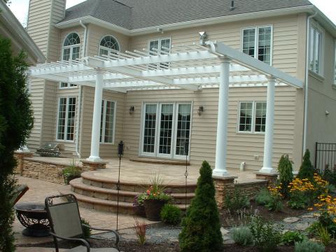 Transitional Patio with white columns around patio