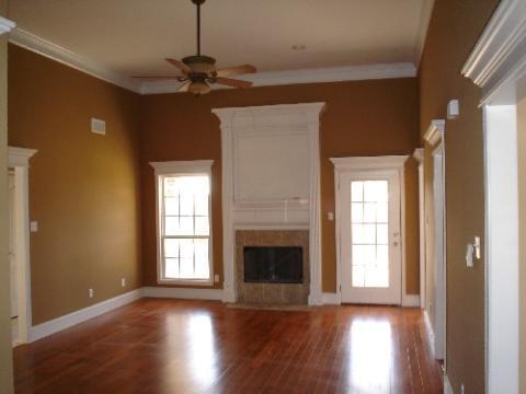 Traditional Family Room with white framed doors and windows