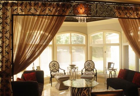 Eclectic Family Room with victorian style arm chairs with black and white upholstery