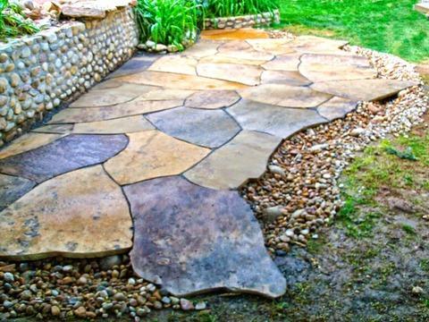 Eclectic Landscape with stone retaining wall