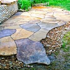 Eclectic Landscape with stone retaining wall