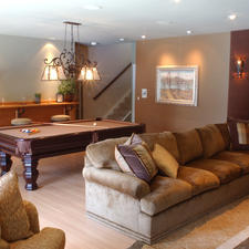 Traditional Basement with light hardwood floor